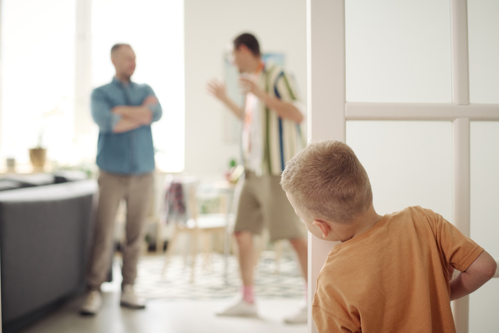 young boy watching his fathers fight