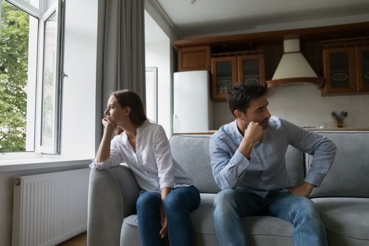 couple on couch facing away from each other